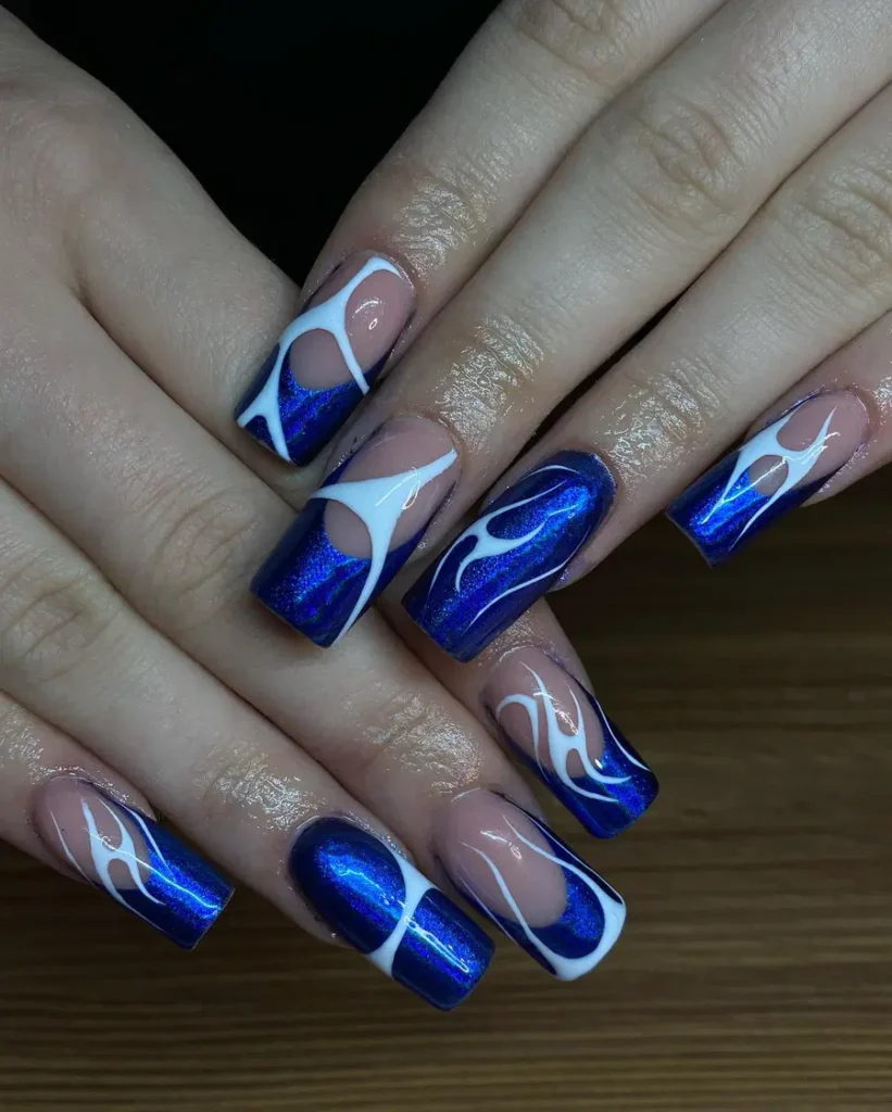 Blue Chrome Nails With Fluid White Swirl Accents