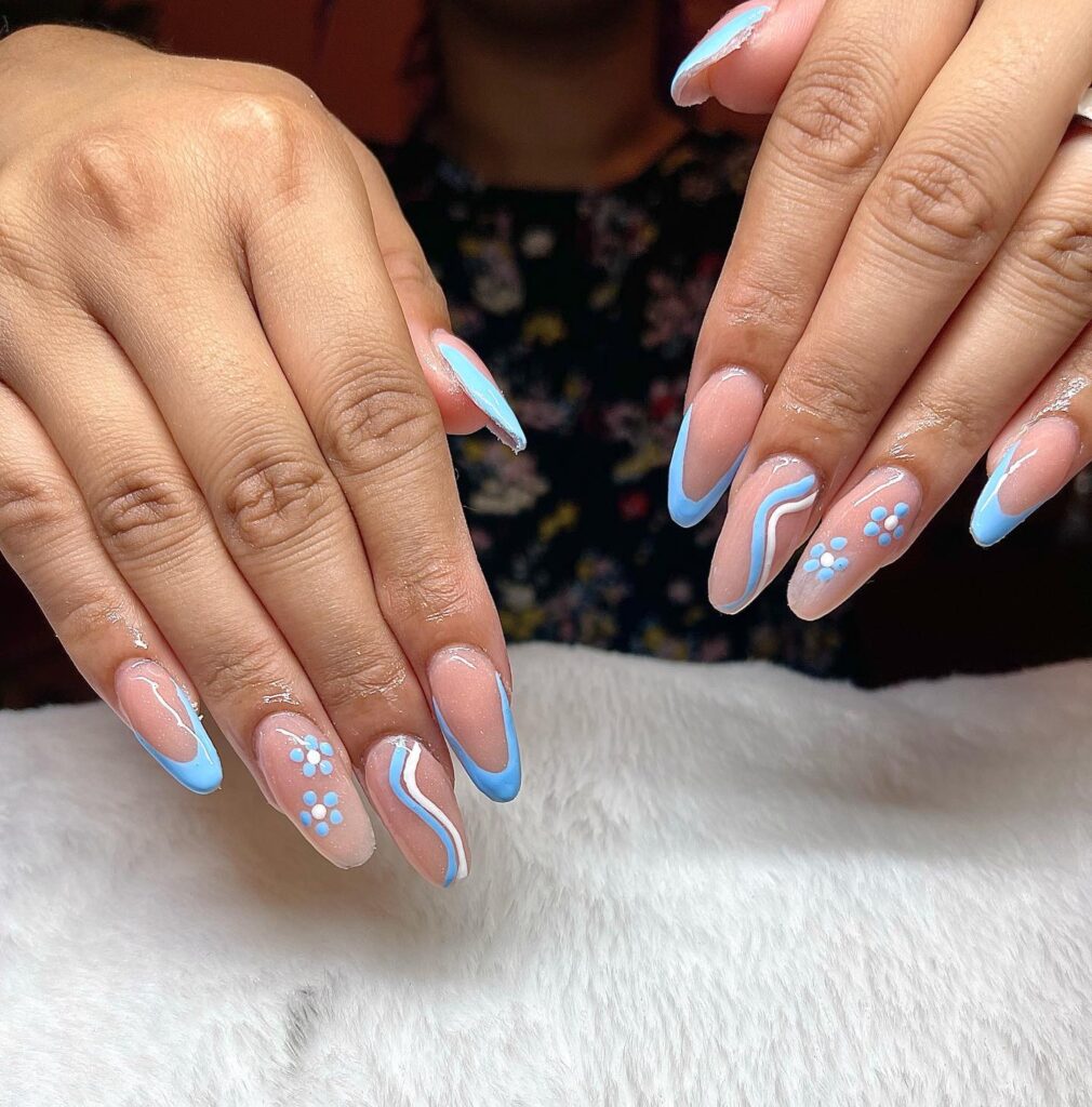 Sky Blue French Tip Nails with Soft Swirls and Floral Dot Details