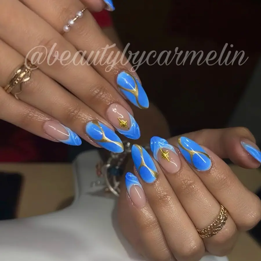 Soft Blue Almond Nails With Gold Line Art and Star Details