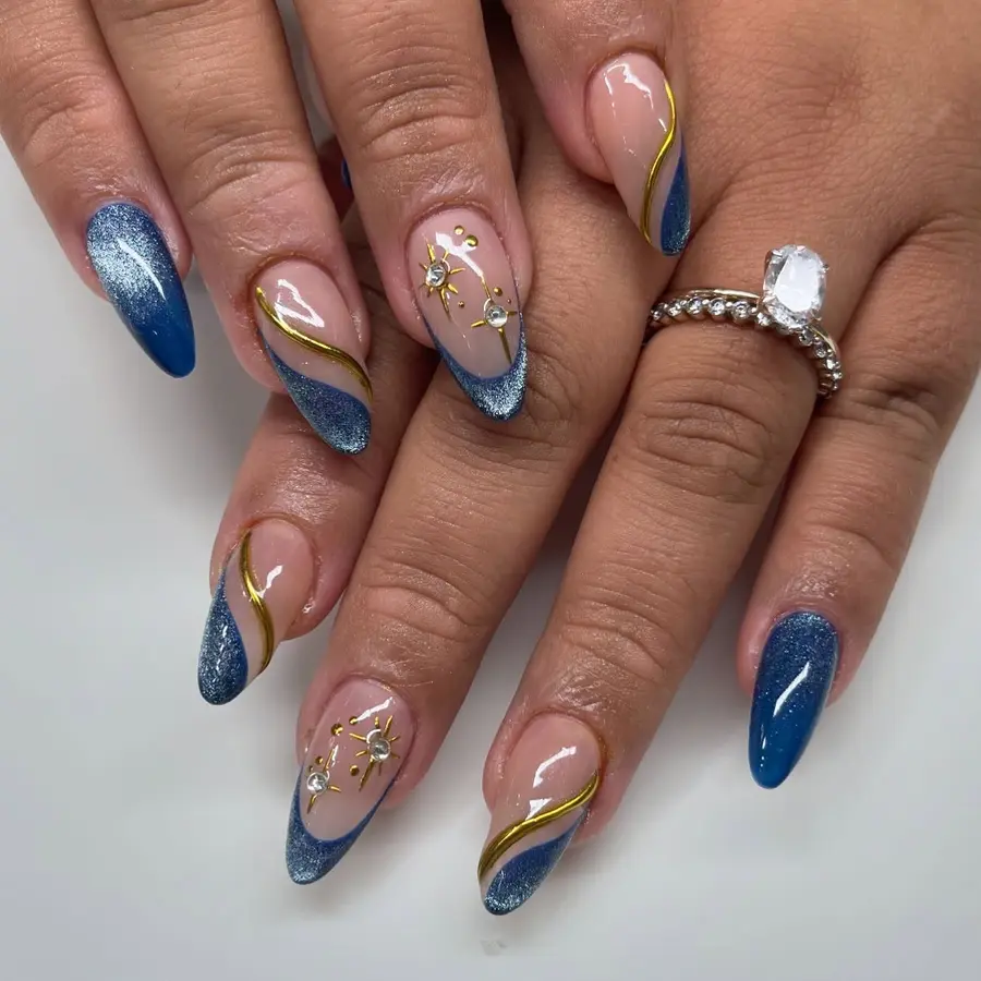 Blue Almond Nails With Shimmer Tips and Gold Celestial Details