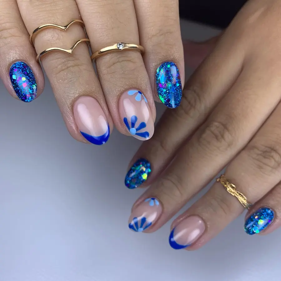 Blue French Almond Nails With Floral Accents and Sparkle
