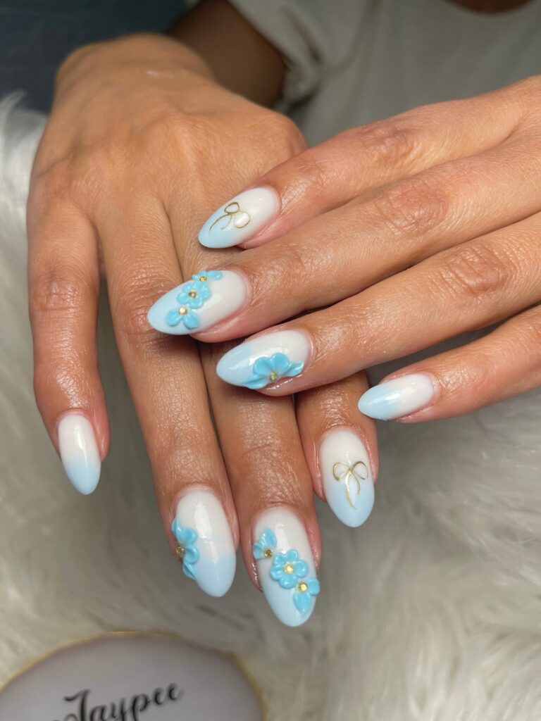 Milky Almond Nails With Floral Accents