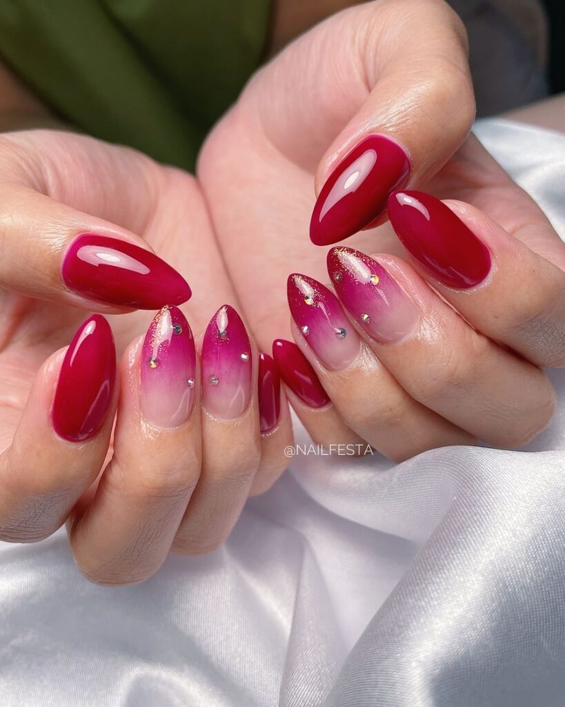 Red Ombre Nails with Glossy Finish and Crystal Accents