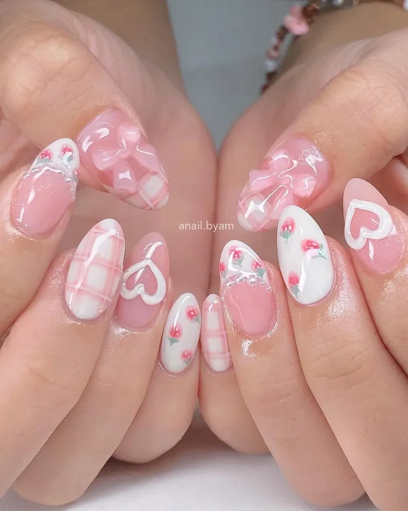 Soft Pink Almond Nails With Heart Details and Floral Accents