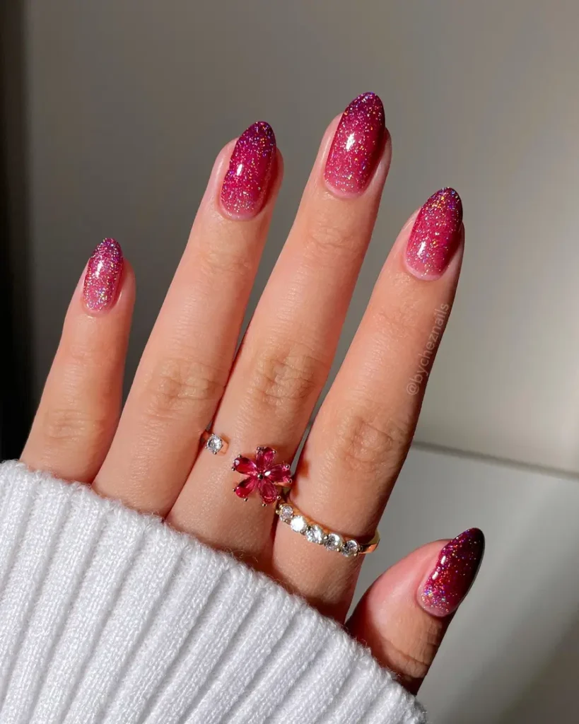 Deep Pink Glitter Almond Nails With a Rich, Sparkly Finish