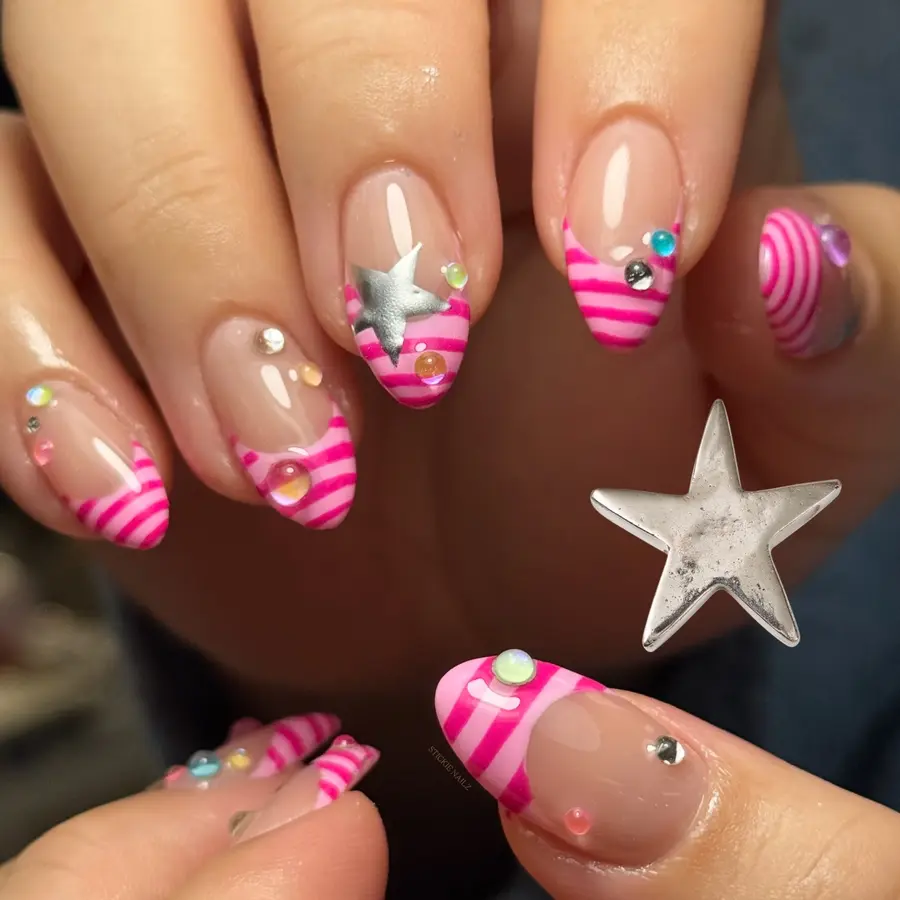 Pink Almond Nails With Candy Stripe Tips and Playful Star Accents