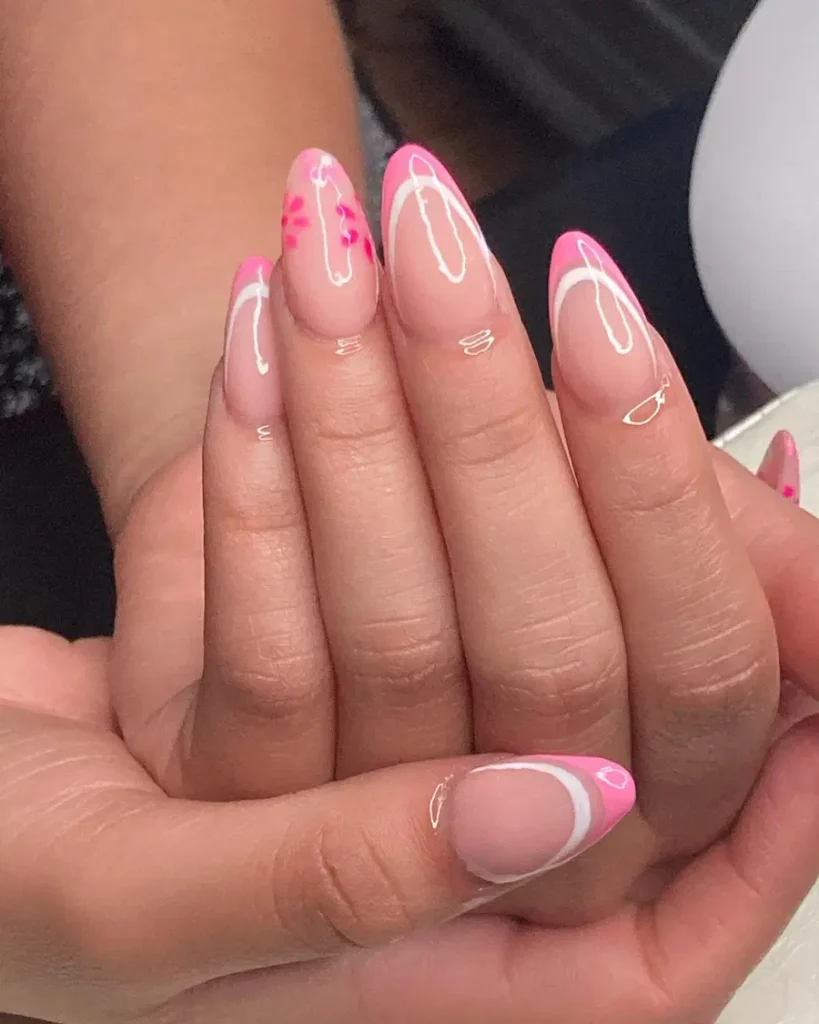 Soft Pink Almond Nails With Slim French Tips and Tiny Floral Accents