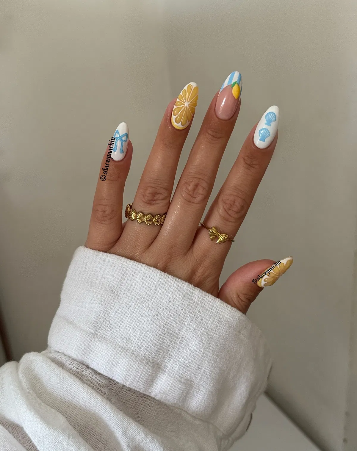 Thin red French tips with small floral accents