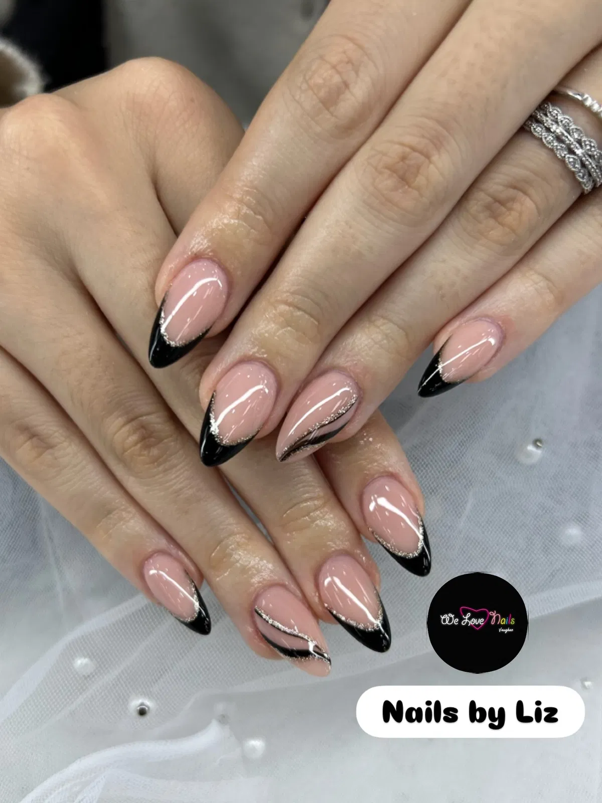 Black French tips with thin glitter outline (text overlay present)