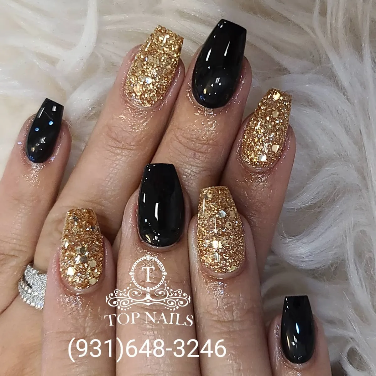 Alternating glossy black and full gold glitter nails