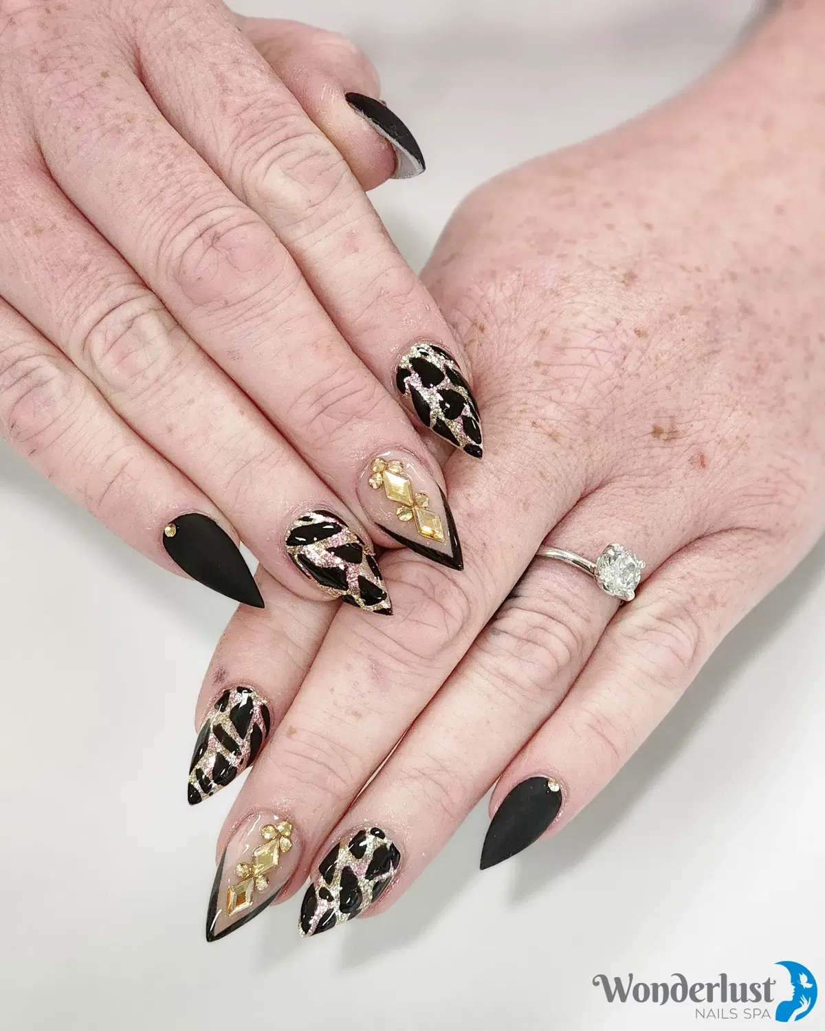 Matte black with metallic crisscross lines and gold embellishments