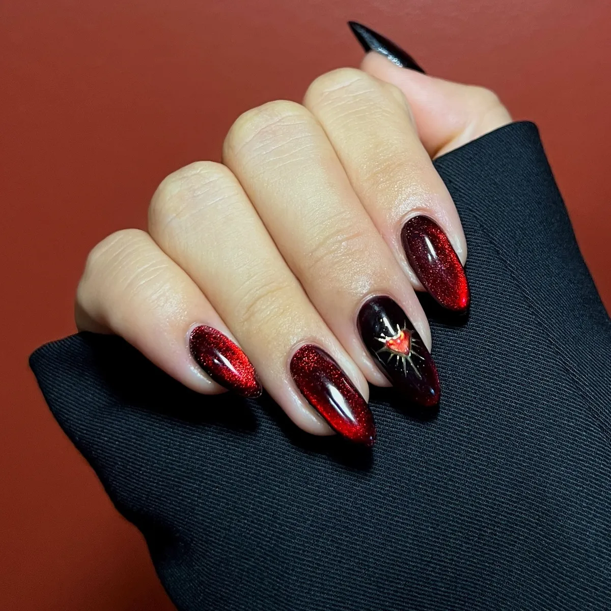 Deep red shimmer with a heart-and-starburst accent