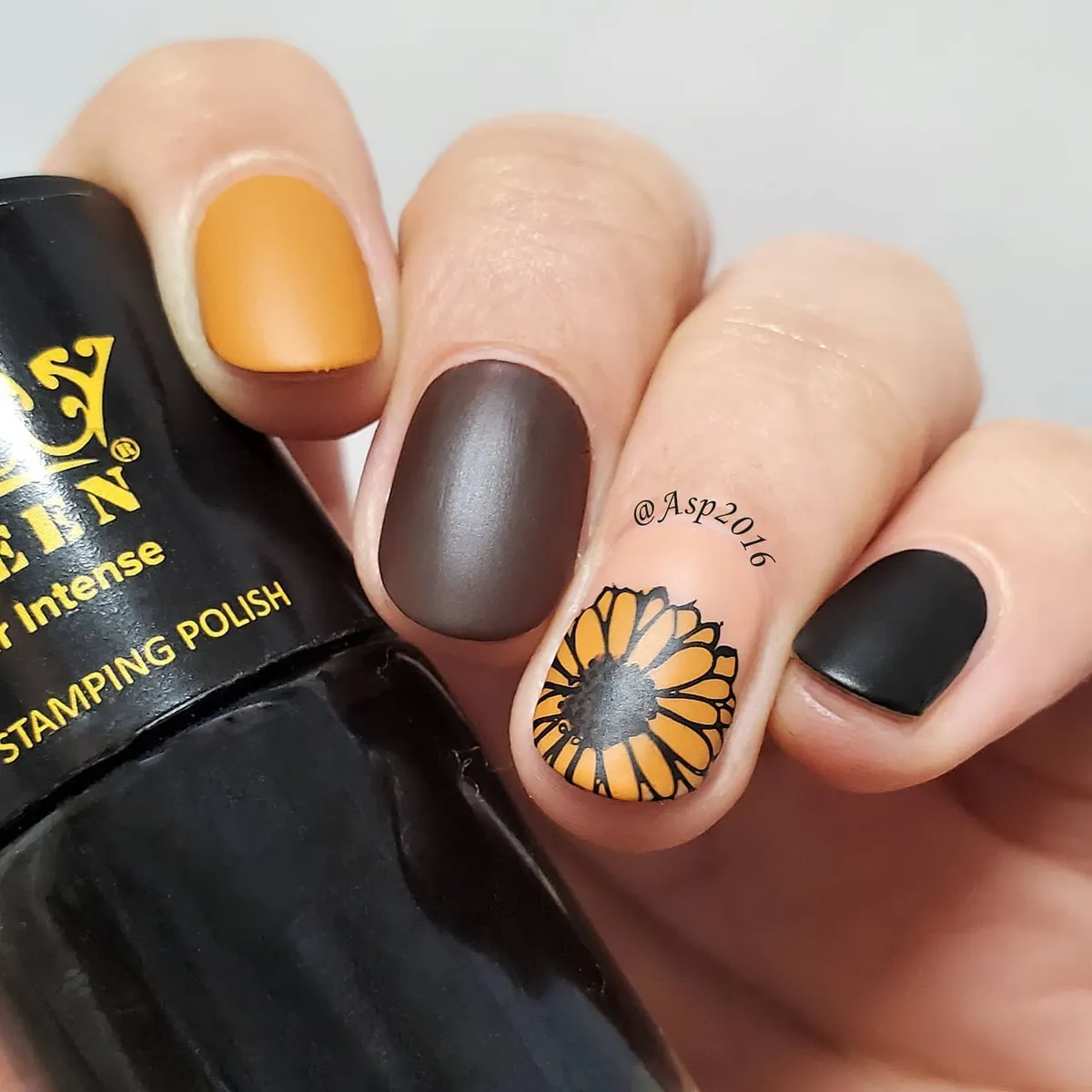 Matte black/brown/orange with a sunflower outline accent