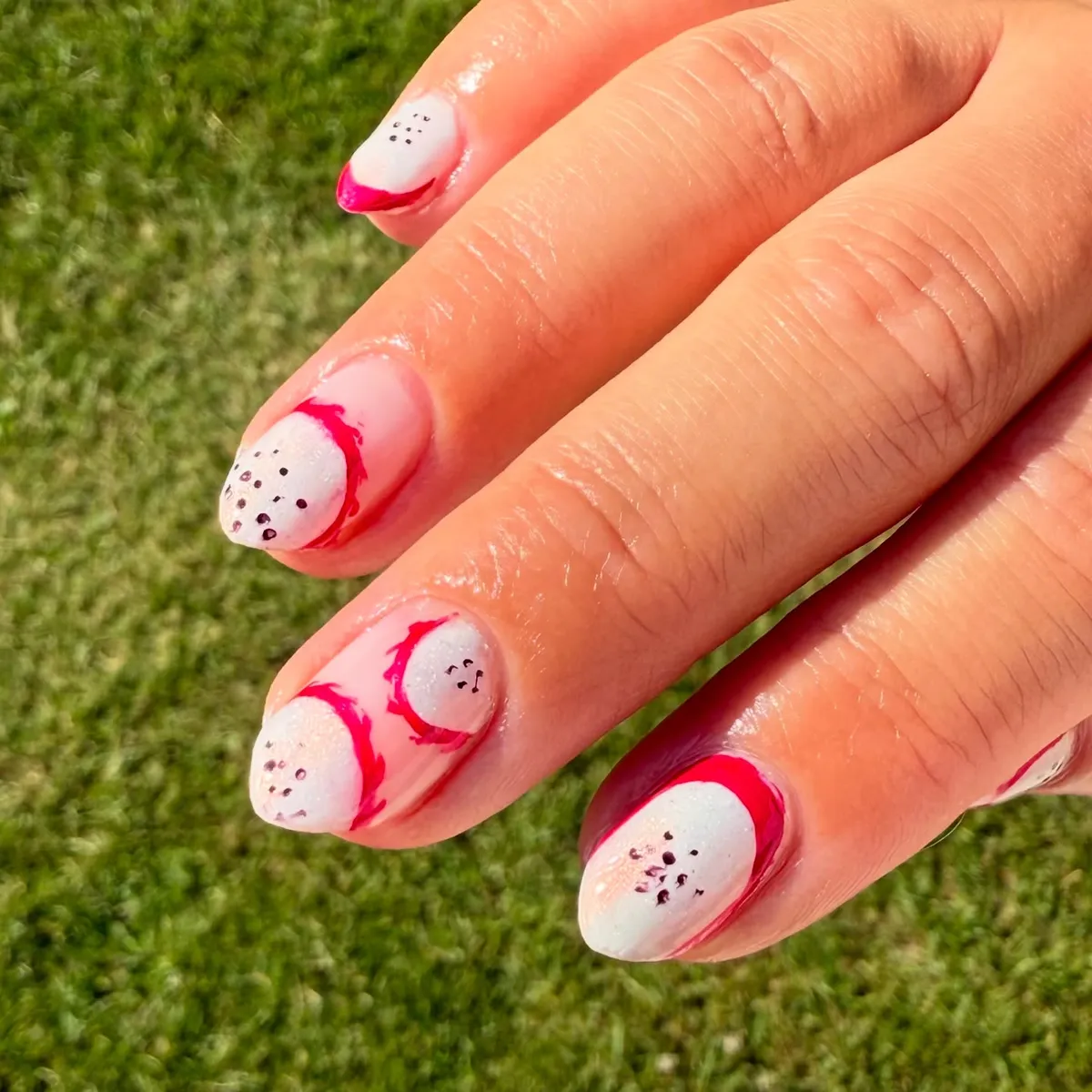 Pink-framed white ovals with speckles