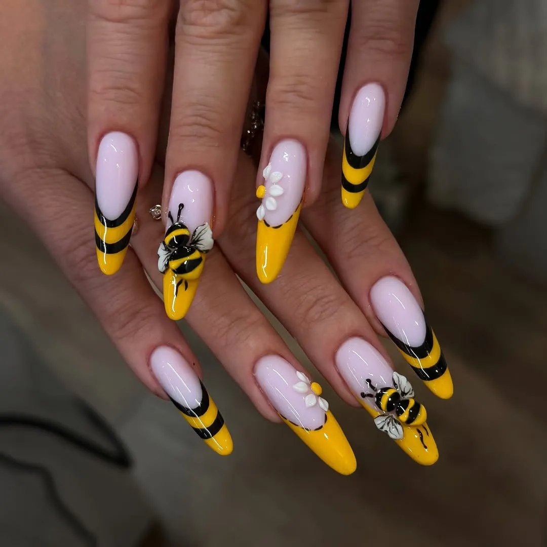 Yellow-and-black French tips with 3D bees and flowers