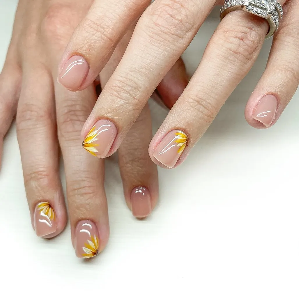 Sheer nude base with yellow-white corner petals