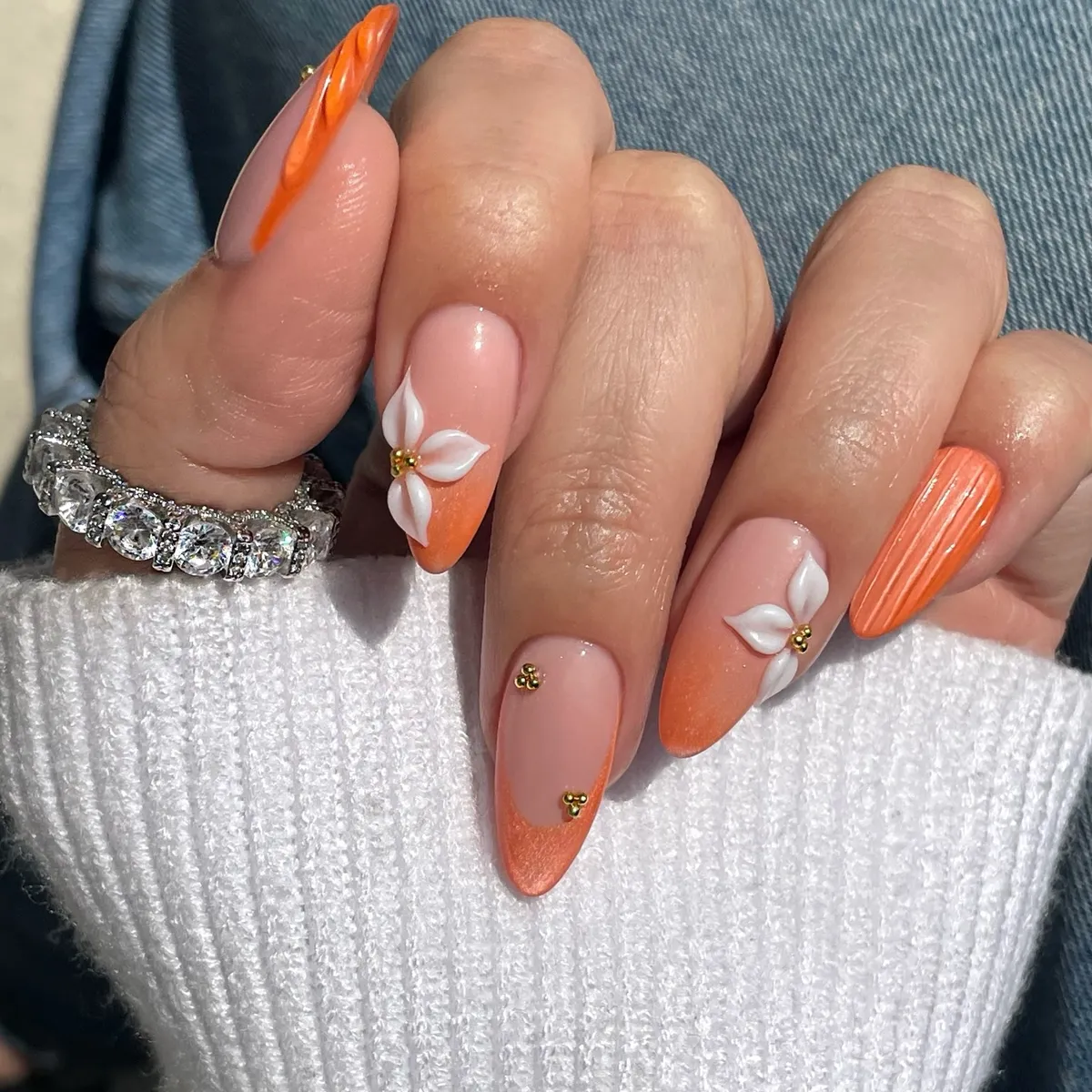 Orange ombré with raised white flowers and textured accent