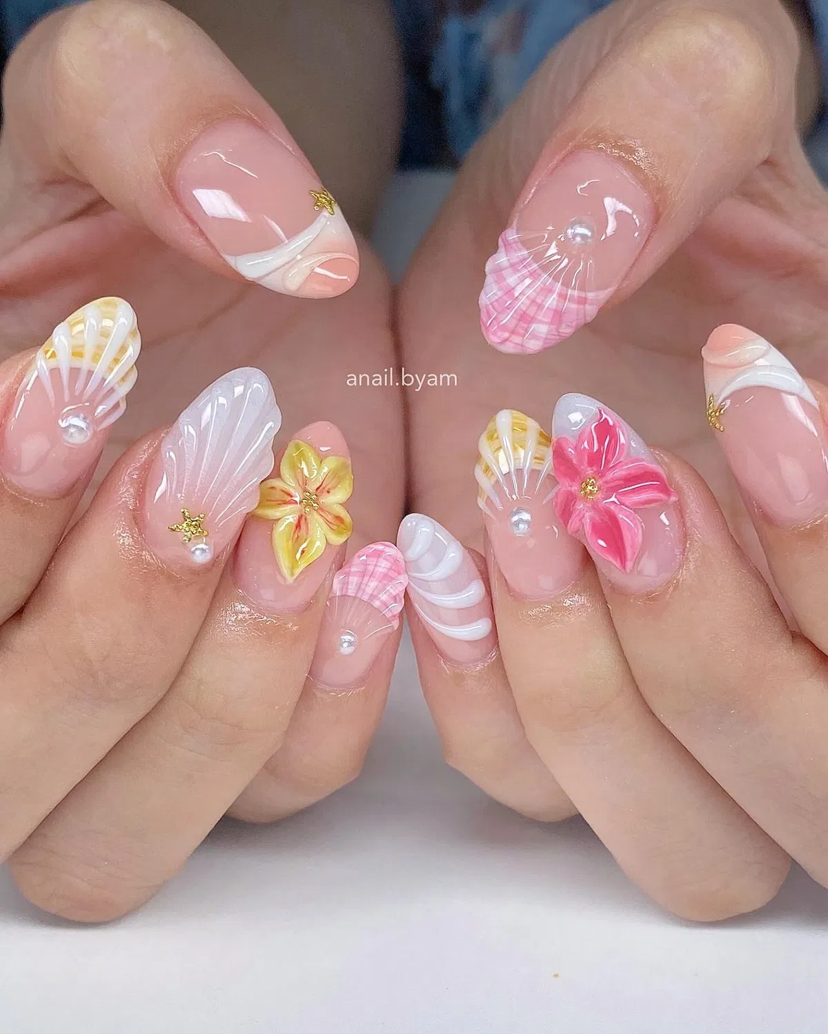 3D shells, pearls, and sculpted floral accents