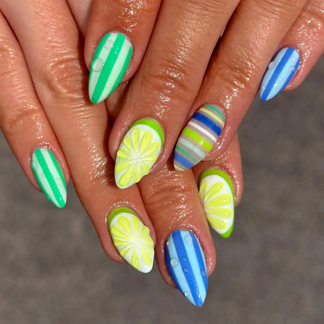 Striped citrus nails with raised droplet details