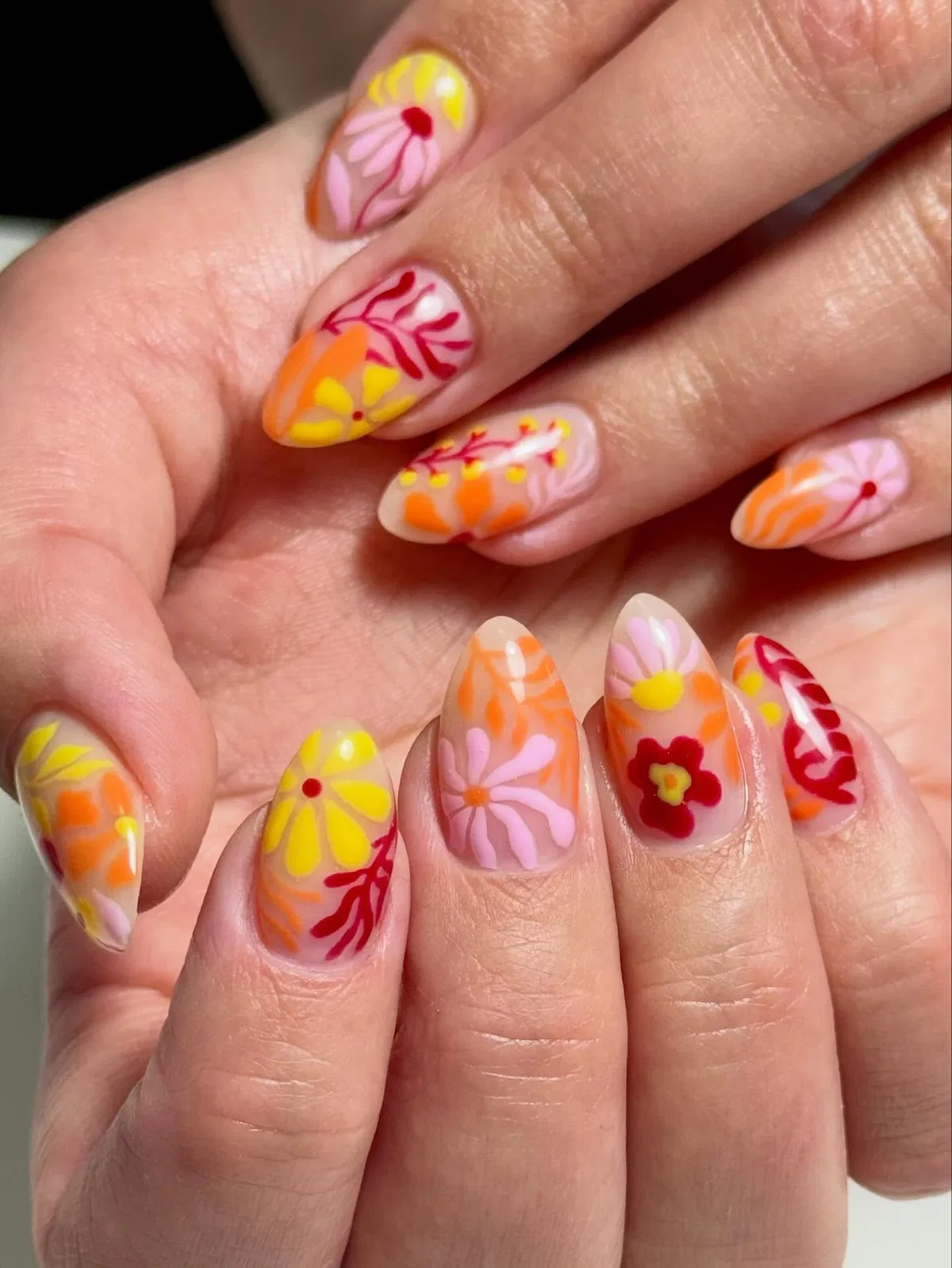 Warm-toned floral mix on a nude base