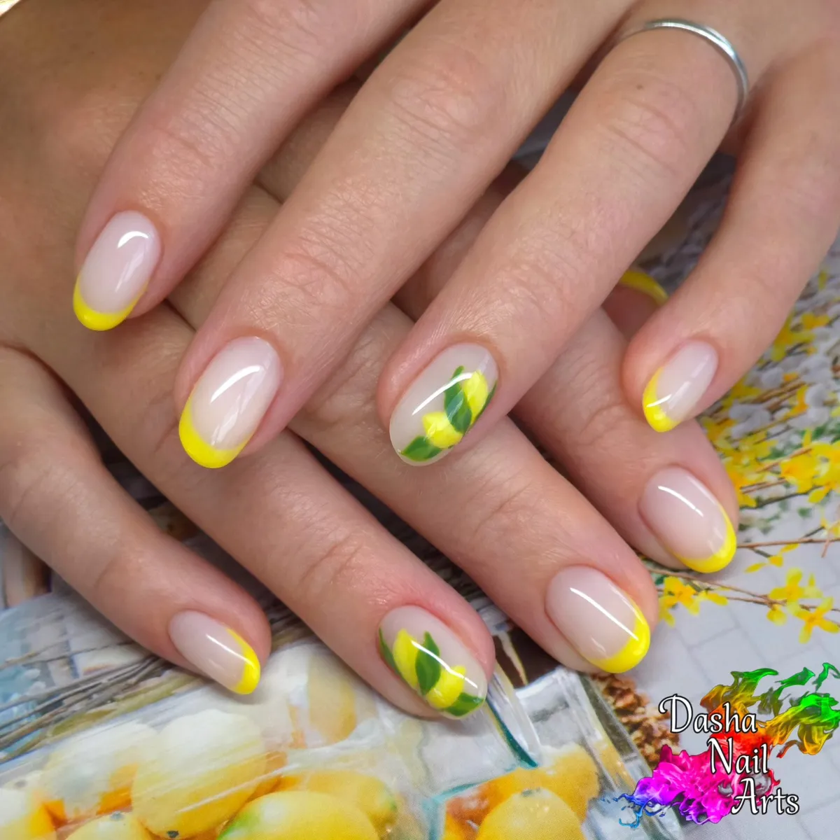 Yellow French tips with lemon-and-leaf accents