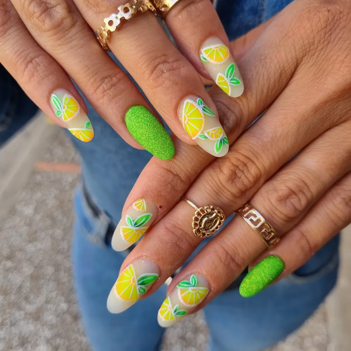 Milky lemon pattern with textured bright-green accent nails