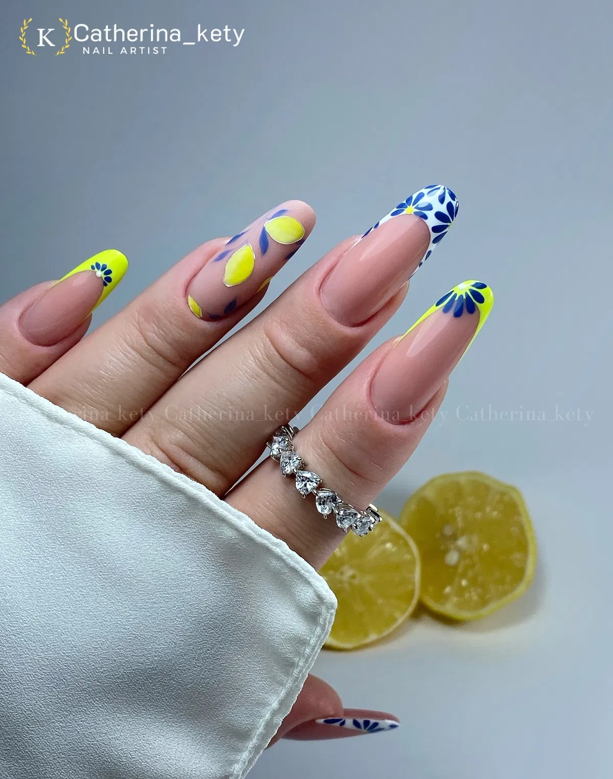 Neon yellow tips with blue floral graphics and fruit motifs