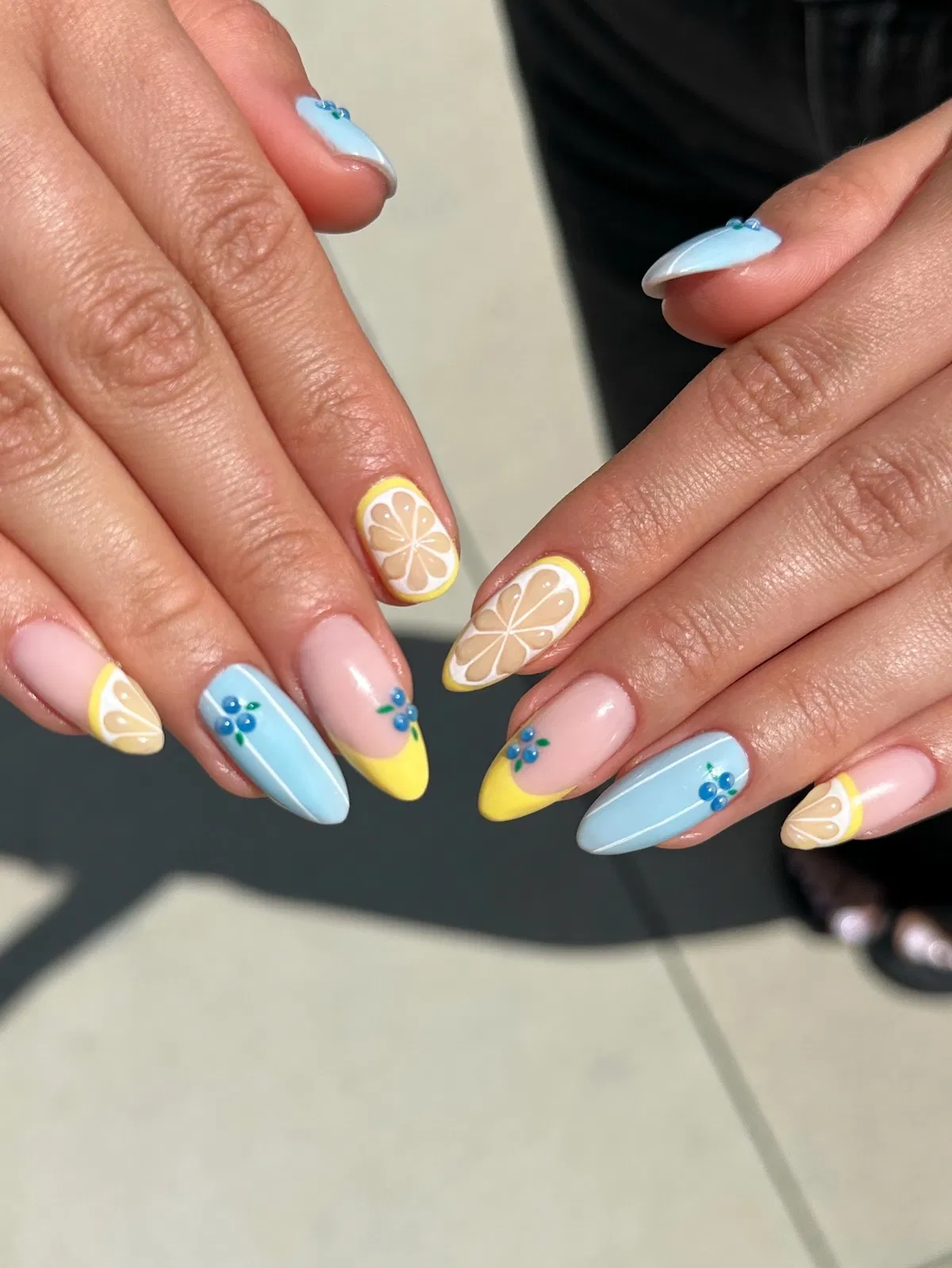 Pastel blue and nude mix with citrus slices and blue floral clusters