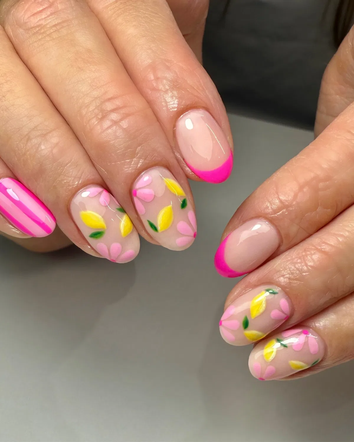 Pink French tips with yellow-and-green fruit accents