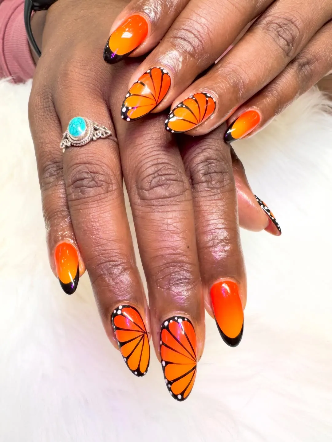 Orange-and-black butterfly-wing nail art