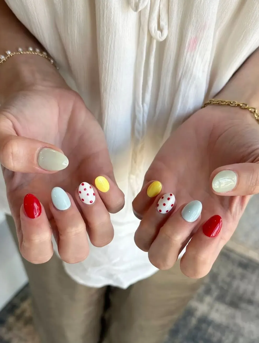 Primary brights with red polka-dot accent nails