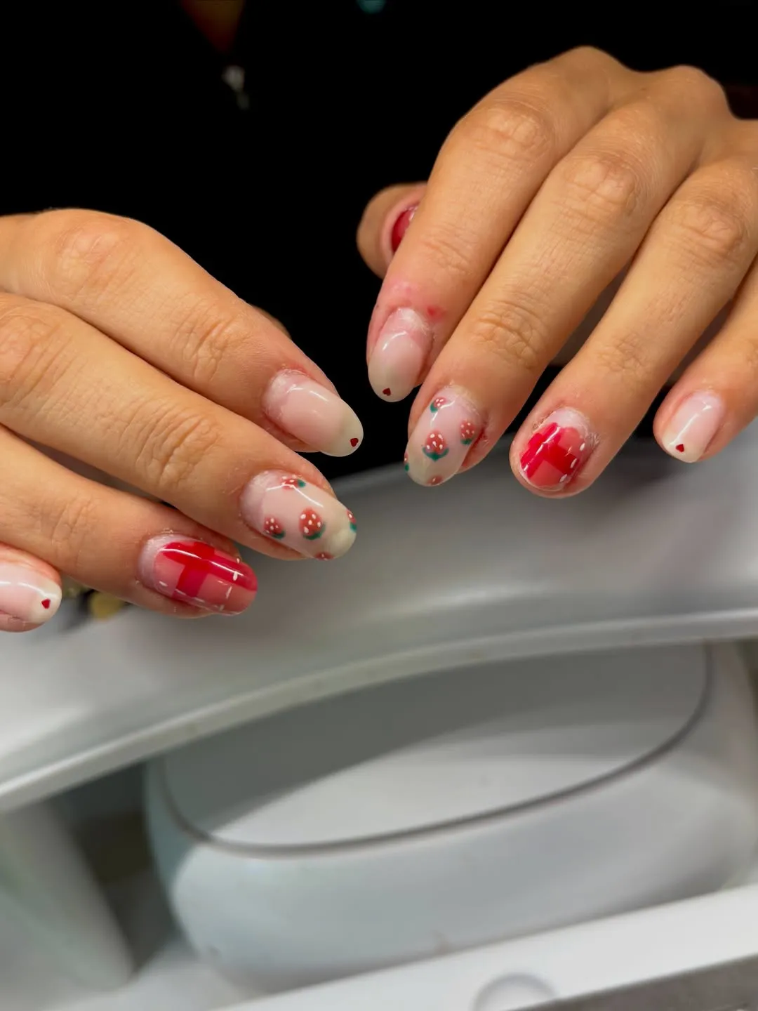 Nude base with tiny hearts, strawberries, and red checks