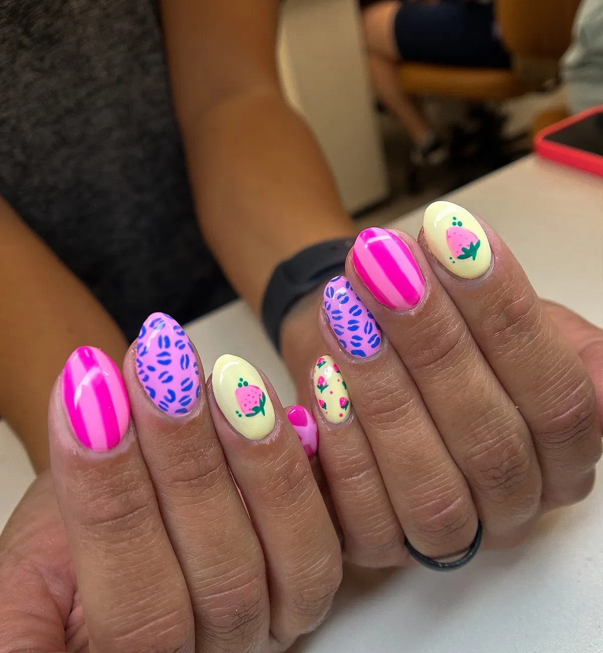 Stripes, leaf-like marks, and strawberry accents