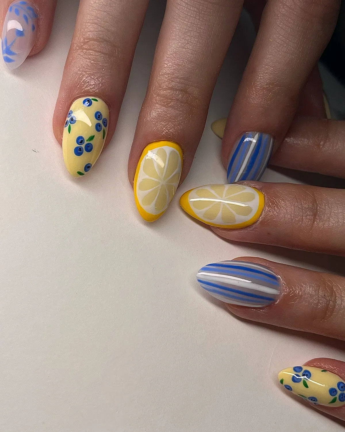 Lemon slices, blue stripes, and berry-like clusters