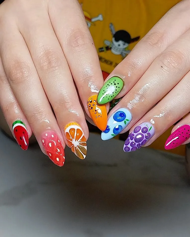 Mixed fruit illustrations on long glossy nails