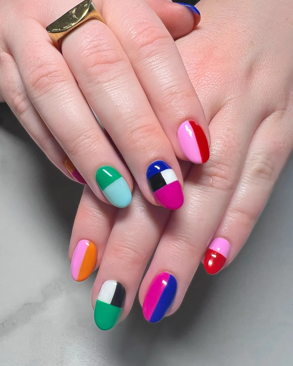 Bright color-block mix on short rounded nails