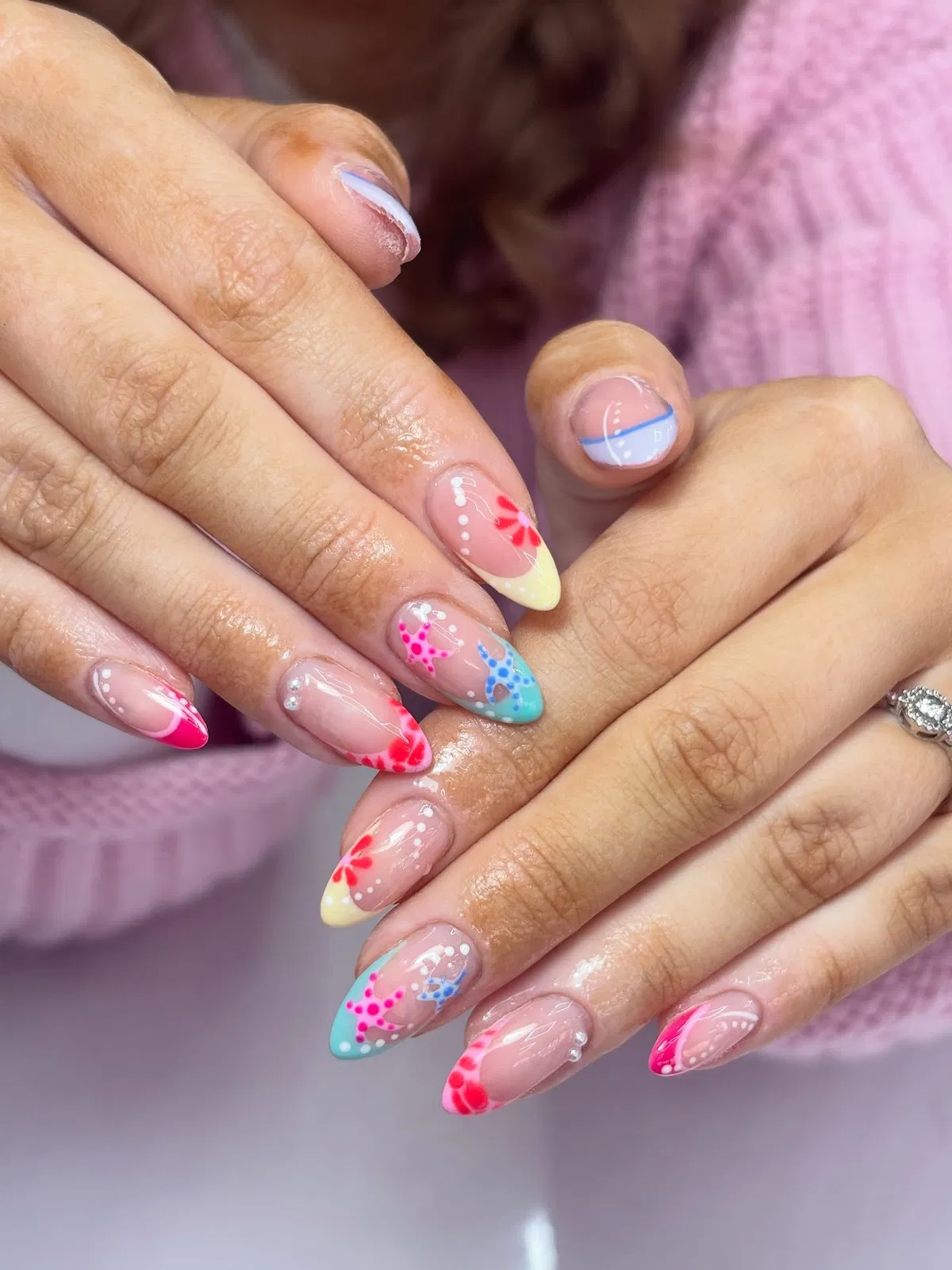 Colorful French tips with starfish and tiny bead accents