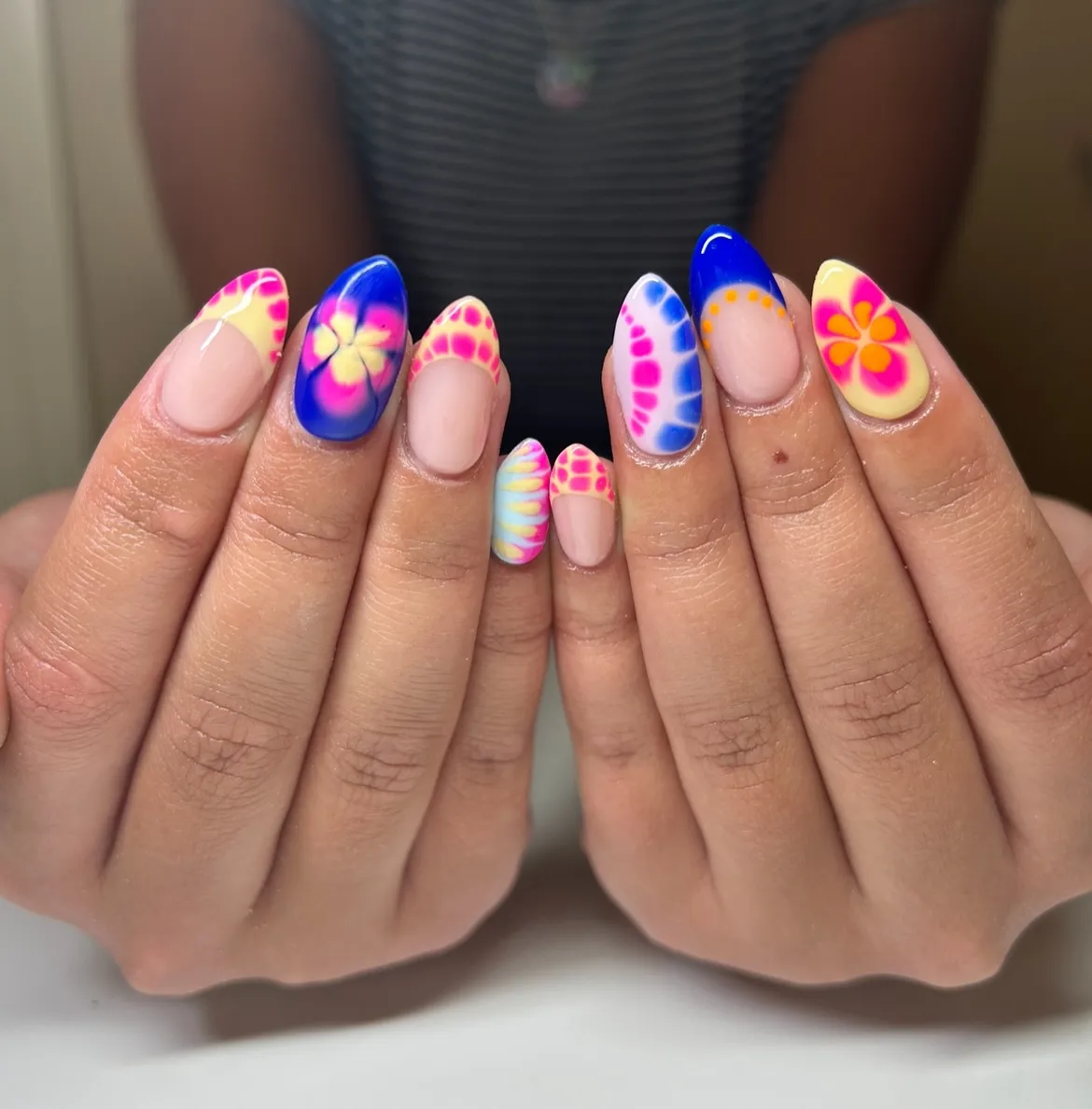 Royal blue florals with neon-tipped patterns and tie-dye accents