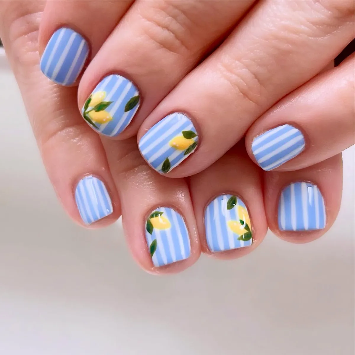Blue-and-white stripes with small yellow fruit motifs