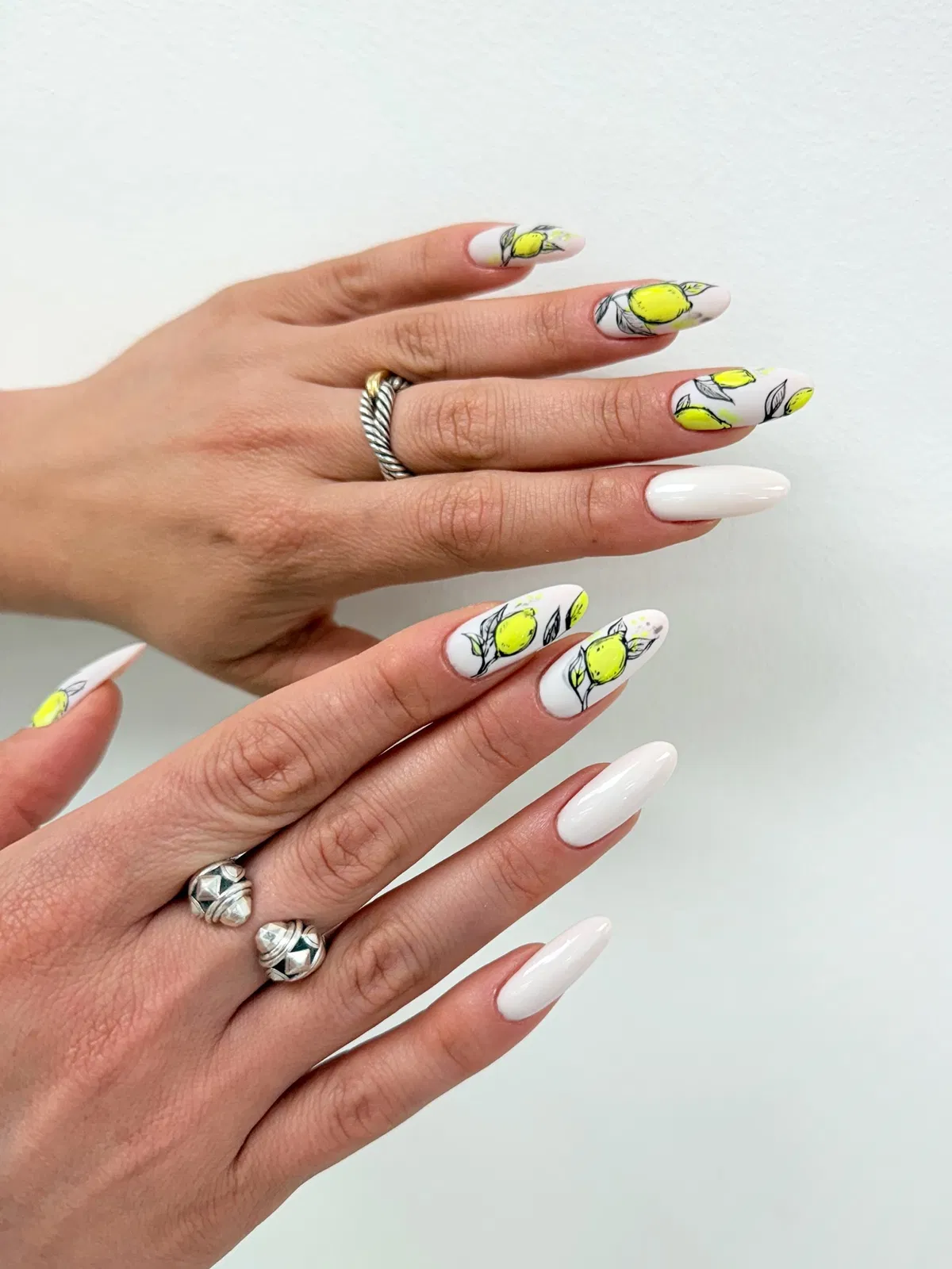 Graphic black-outlined yellow fruit on white base