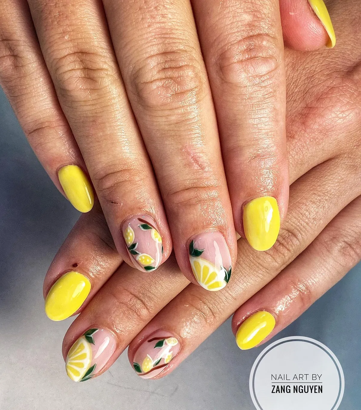 Bright yellow solids with citrus wedges and leafy fruit accents