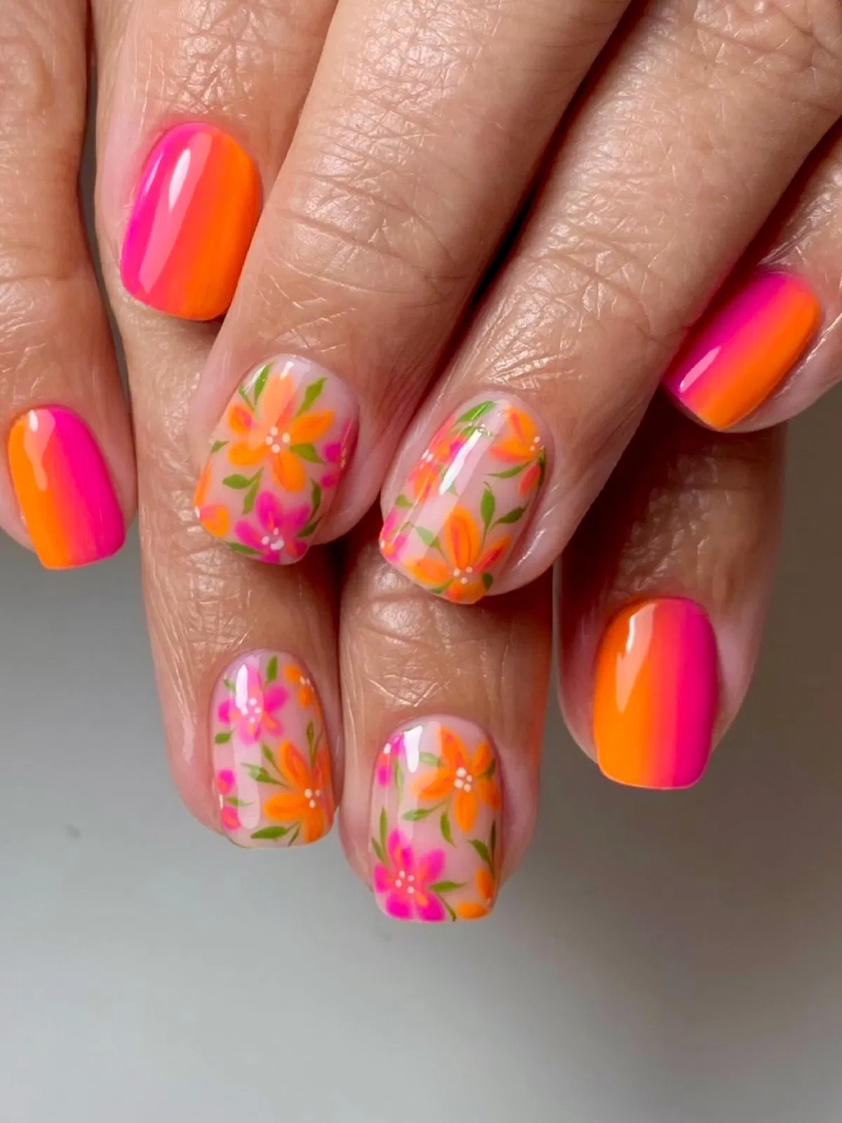 Hot pink-to-orange gradients with floral accents