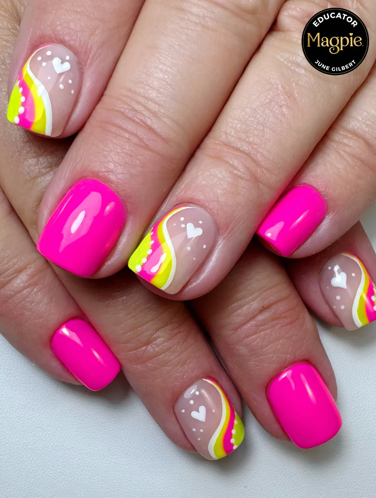 Hot pink solids with nude accents, wavy stripes, dots, and hearts
