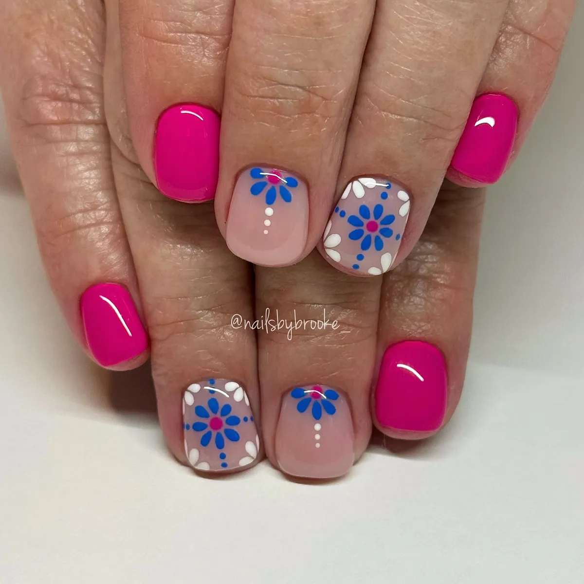 Hot pink with blue-and-white floral graphic accents