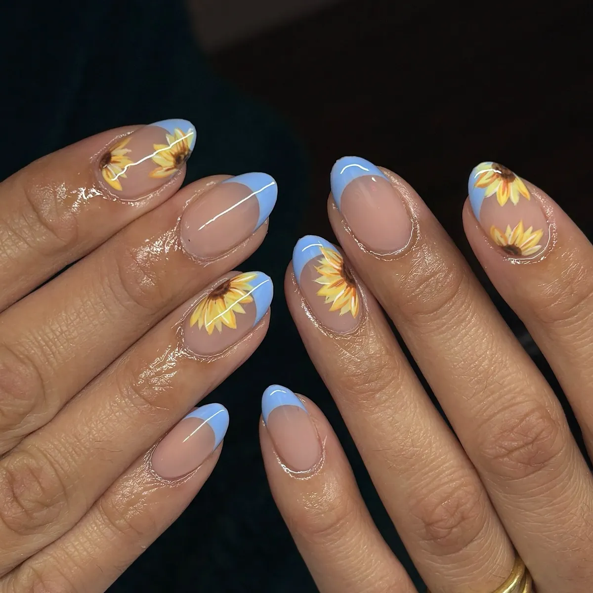 Light blue French tips with sunflower accents