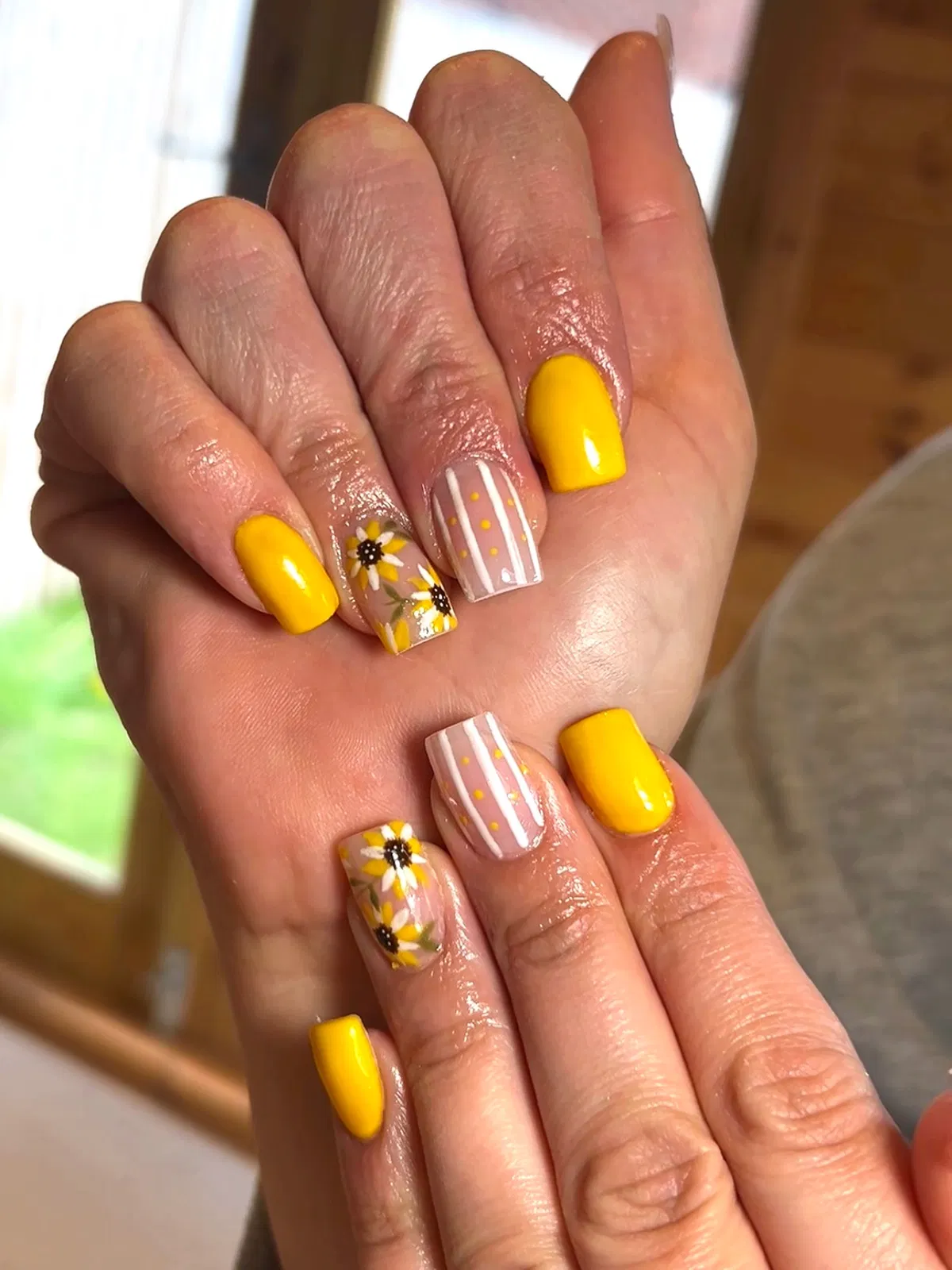 Bright yellow solids with striped-and-dotted nude accents plus florals