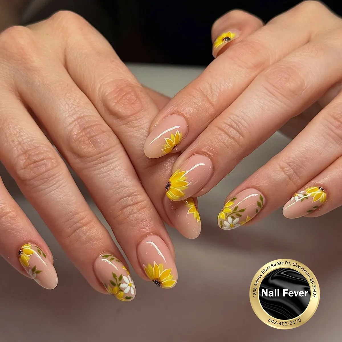 Nude base with yellow florals, white blossoms, and green vines