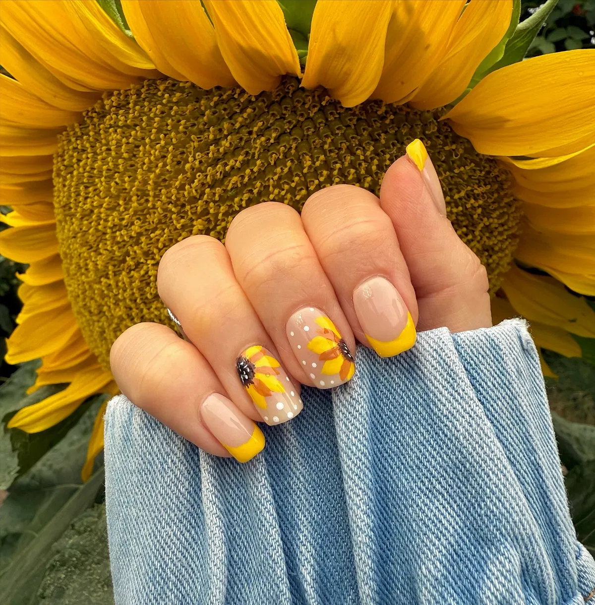 Yellow French tips with dotted nude floral accents