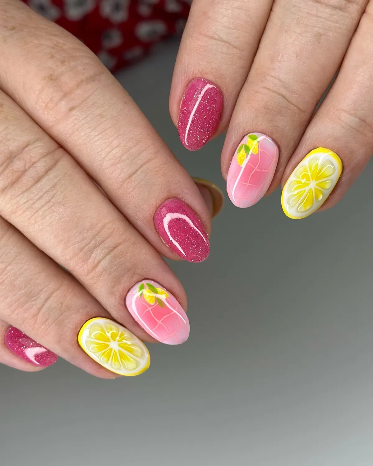 Glittery pinks with lemon slices and subtle line-grid accents