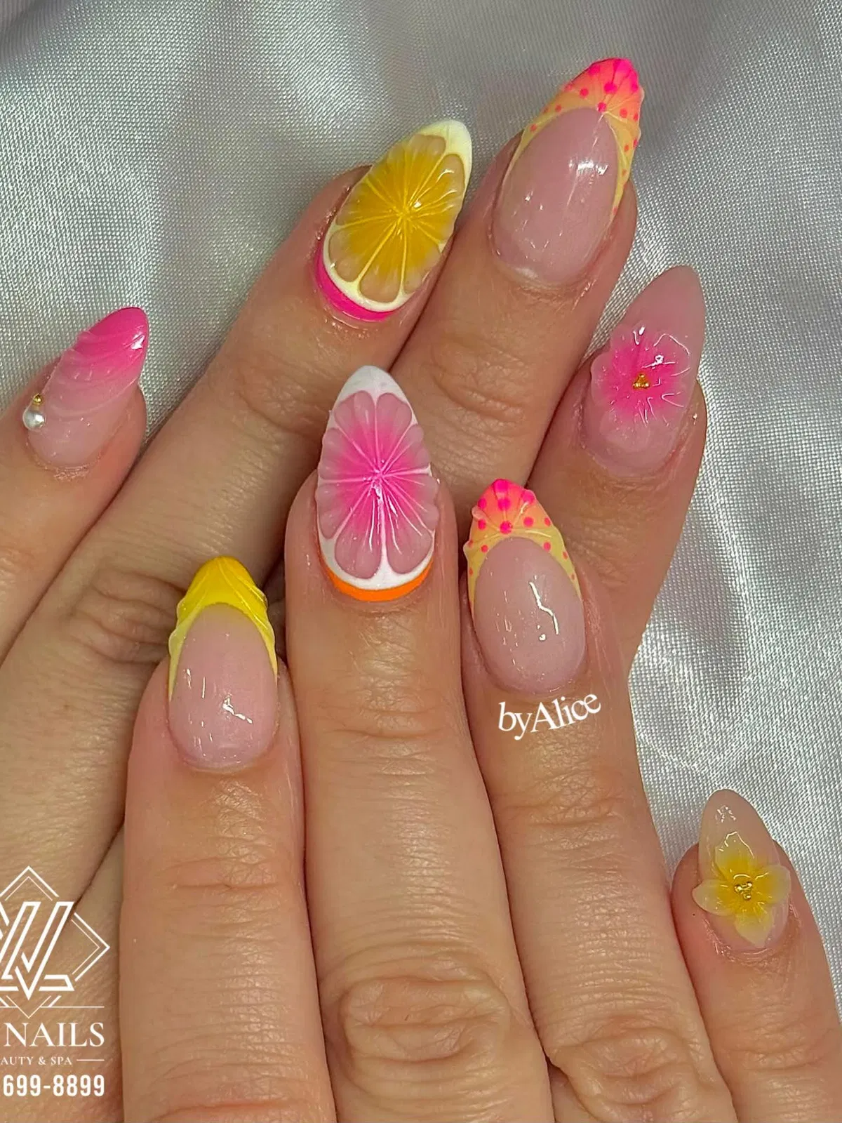 Pointed nails with lemon slice feature and raised floral details